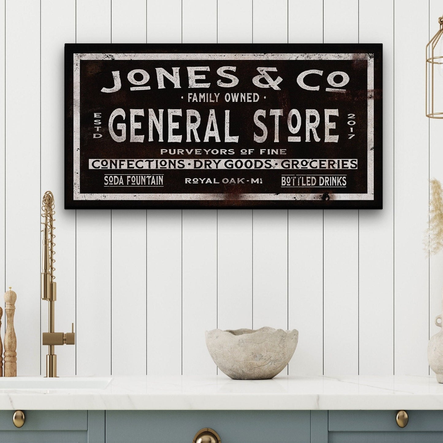 Custom dry goods canvas sign mounted on exposed red brick wall in industrial setting