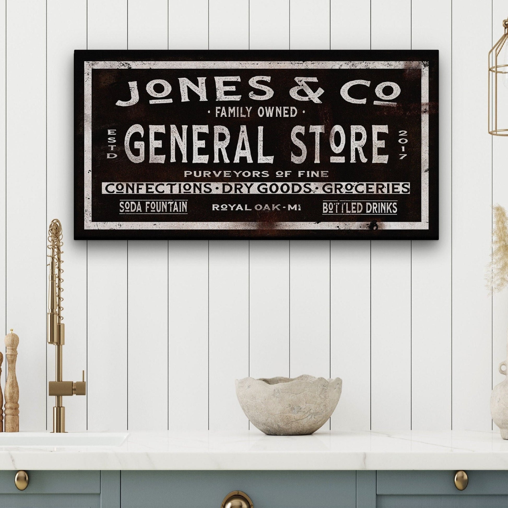 Custom dry goods canvas sign mounted on exposed red brick wall in industrial setting
