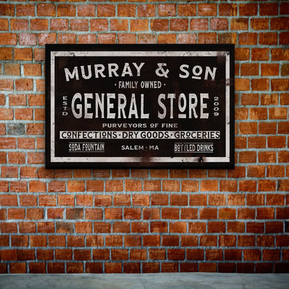 Rustic dry goods canvas sign leaning against white wooden wall showing full design detail