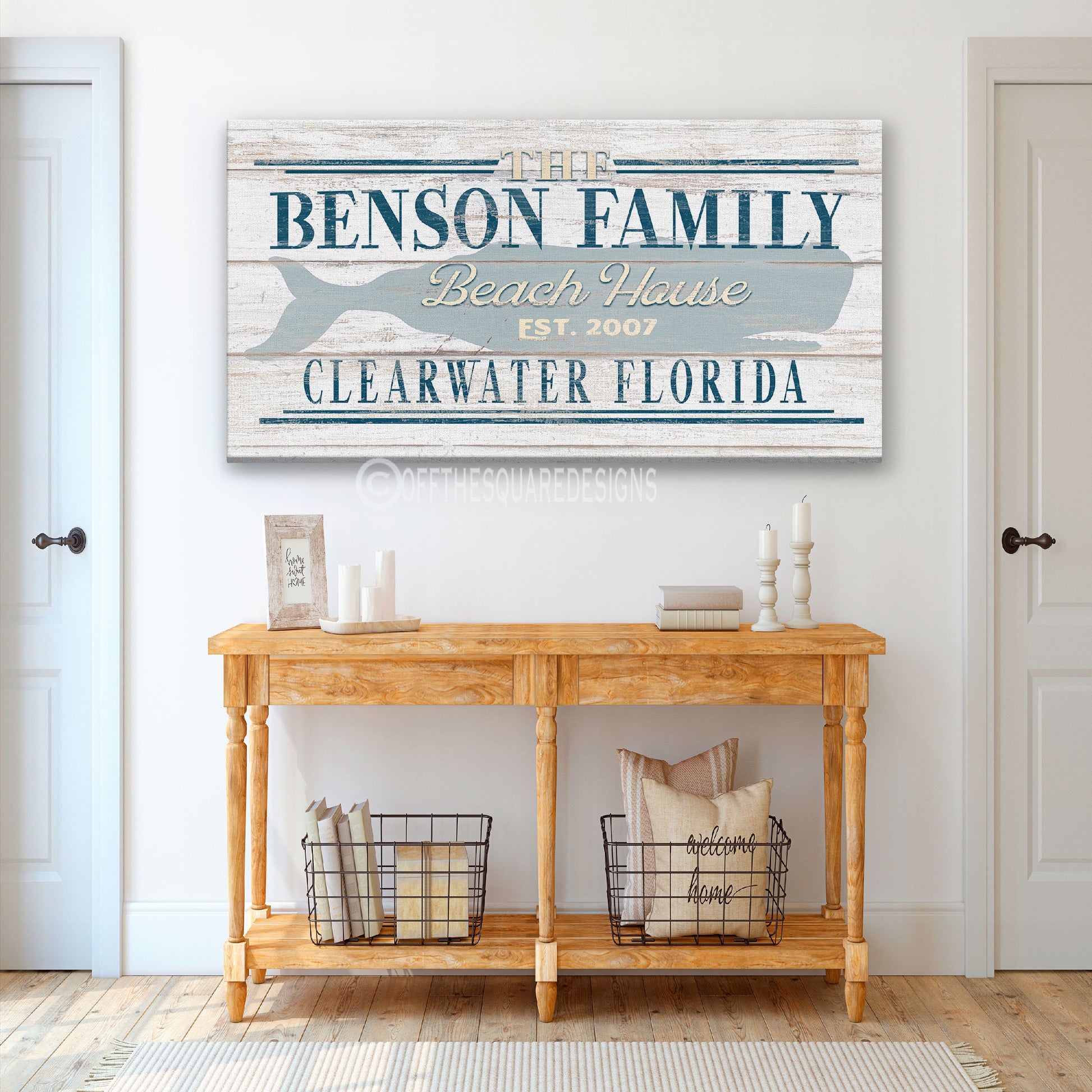 Personalized whale beach sign in living room with coastal shelving and nautical decor