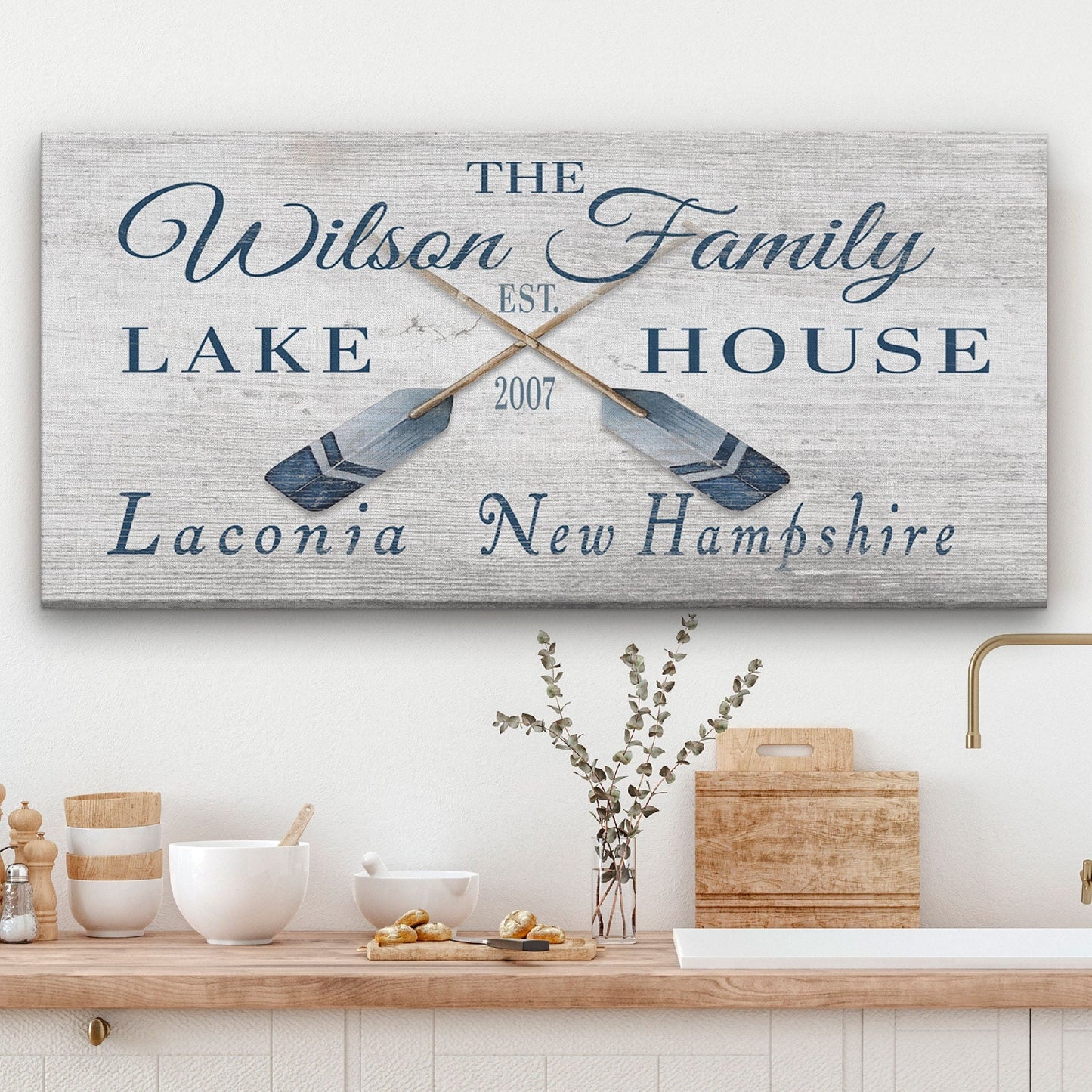 Personalized coordinates sign with crossed oars and GPS location on rustic wood background