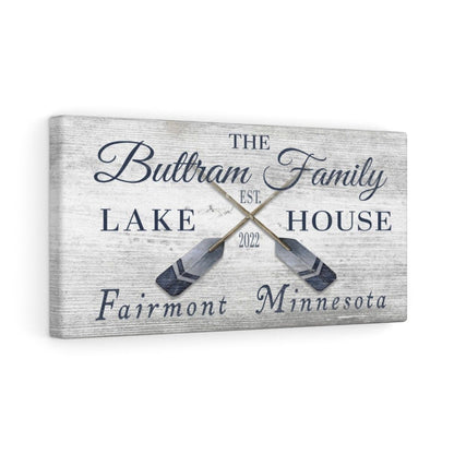 Custom coordinates sign on cabin wall with wood paneling and nautical decor accents