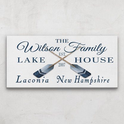 Oars and paddles coordinates sign close-up showing personalized text and rustic canvas detail