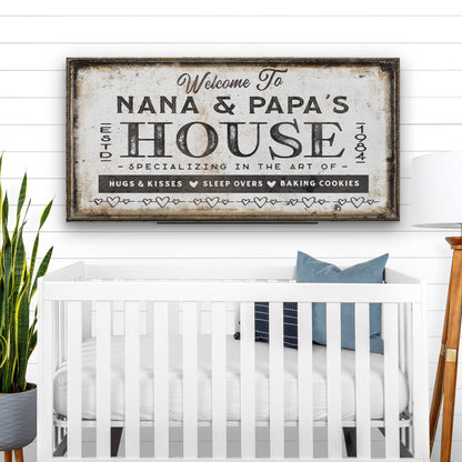 Grandparent welcome sign framed on white wall in bright living room setting