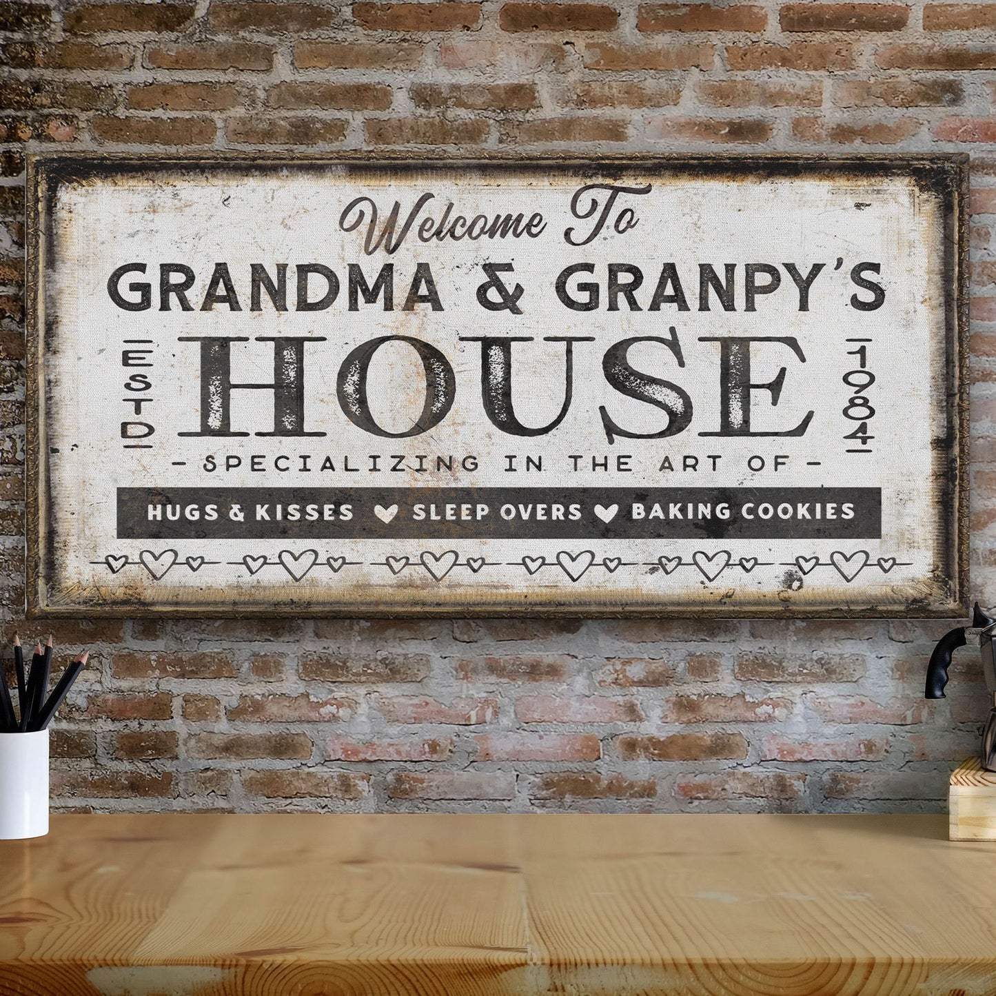 Custom grandma and grandpas sign displayed above coastal sofa with blue throw pillow