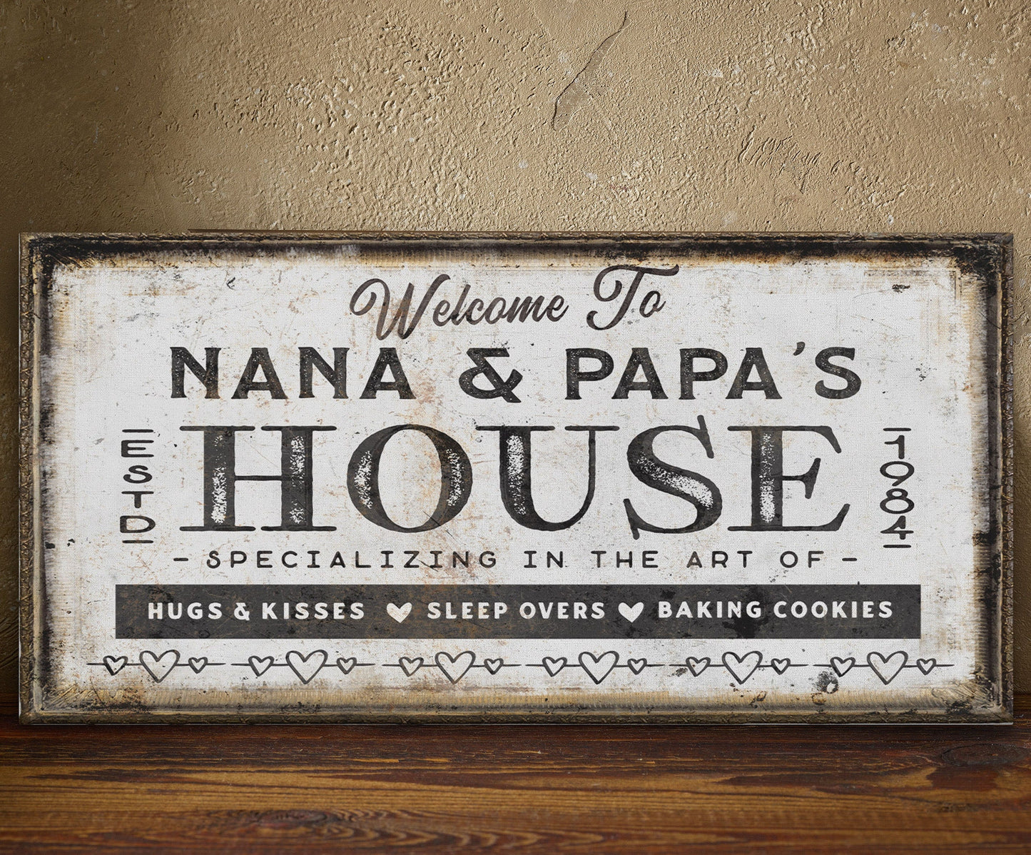 Grandma and grandpas sign in gallery wall arrangement with mixed coastal art pieces