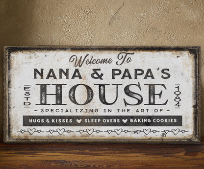 Grandma and grandpas sign in gallery wall arrangement with mixed coastal art pieces