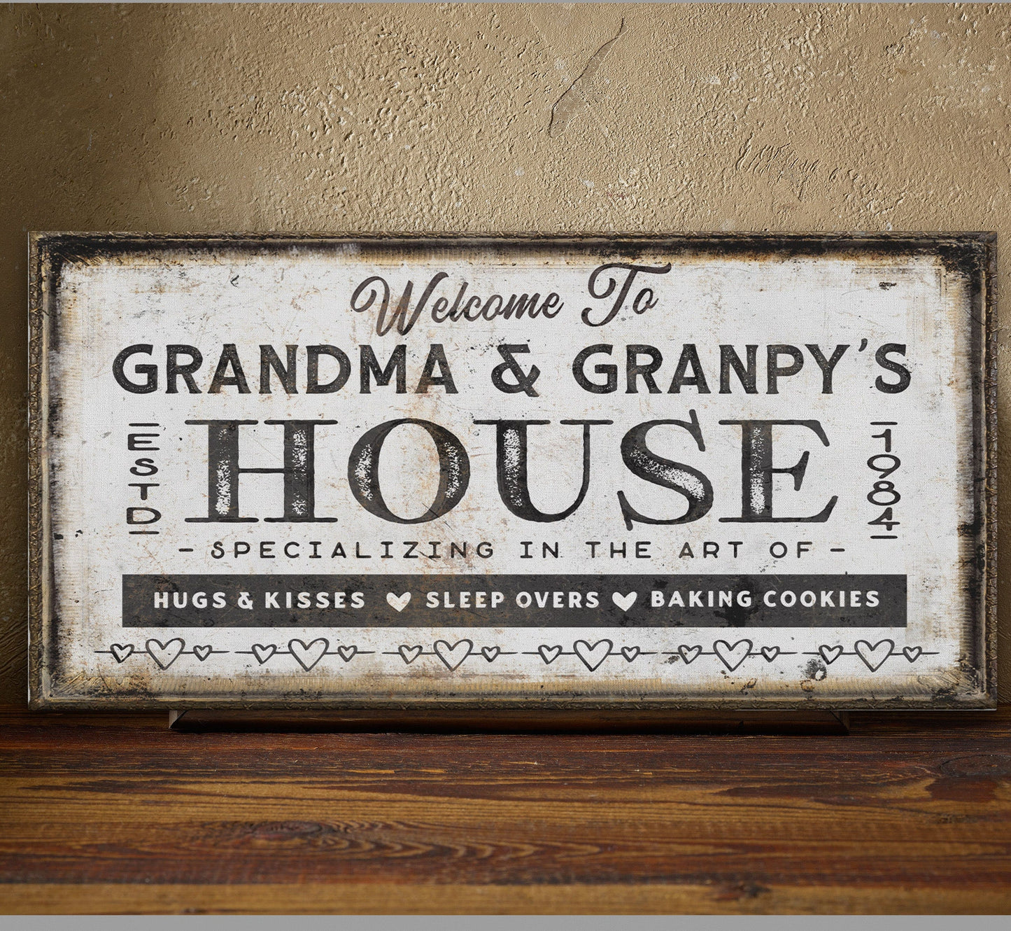 Grandma and grandpas house sign in entryway above wooden console table with coastal decor