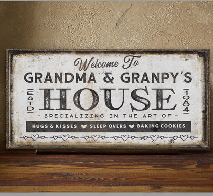 Grandma and grandpas house sign in entryway above wooden console table with coastal decor
