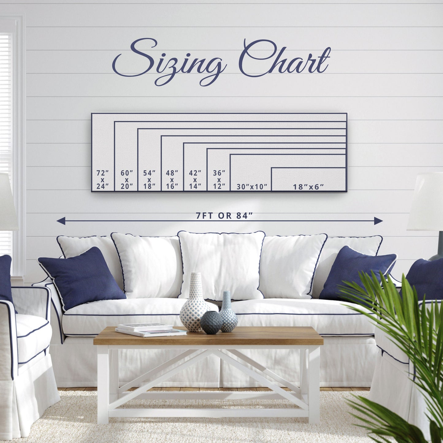 Personalized whale sign in gallery wall arrangement with mixed nautical prints and cohesive display