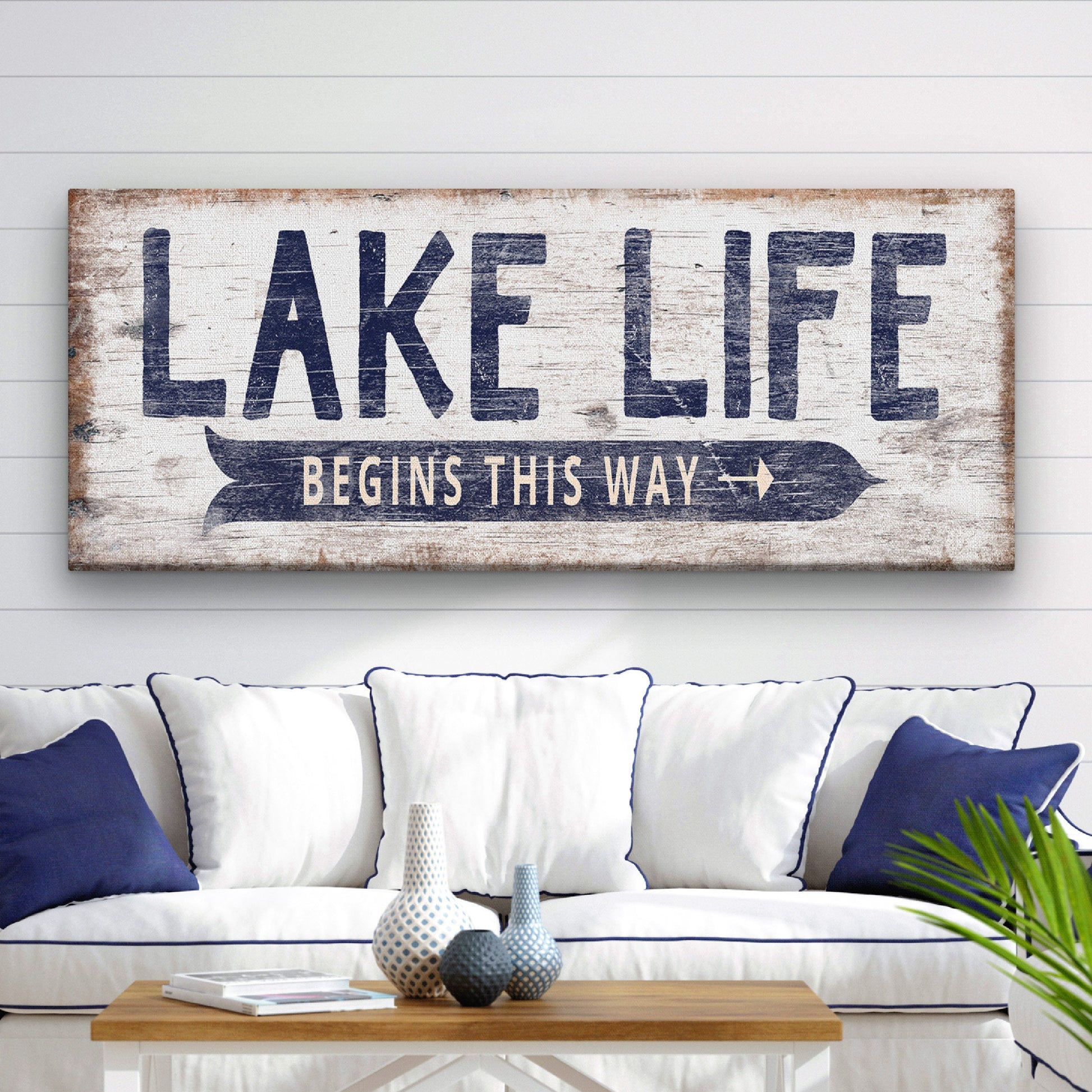 Custom lake signs displayed in a coastal-style living room