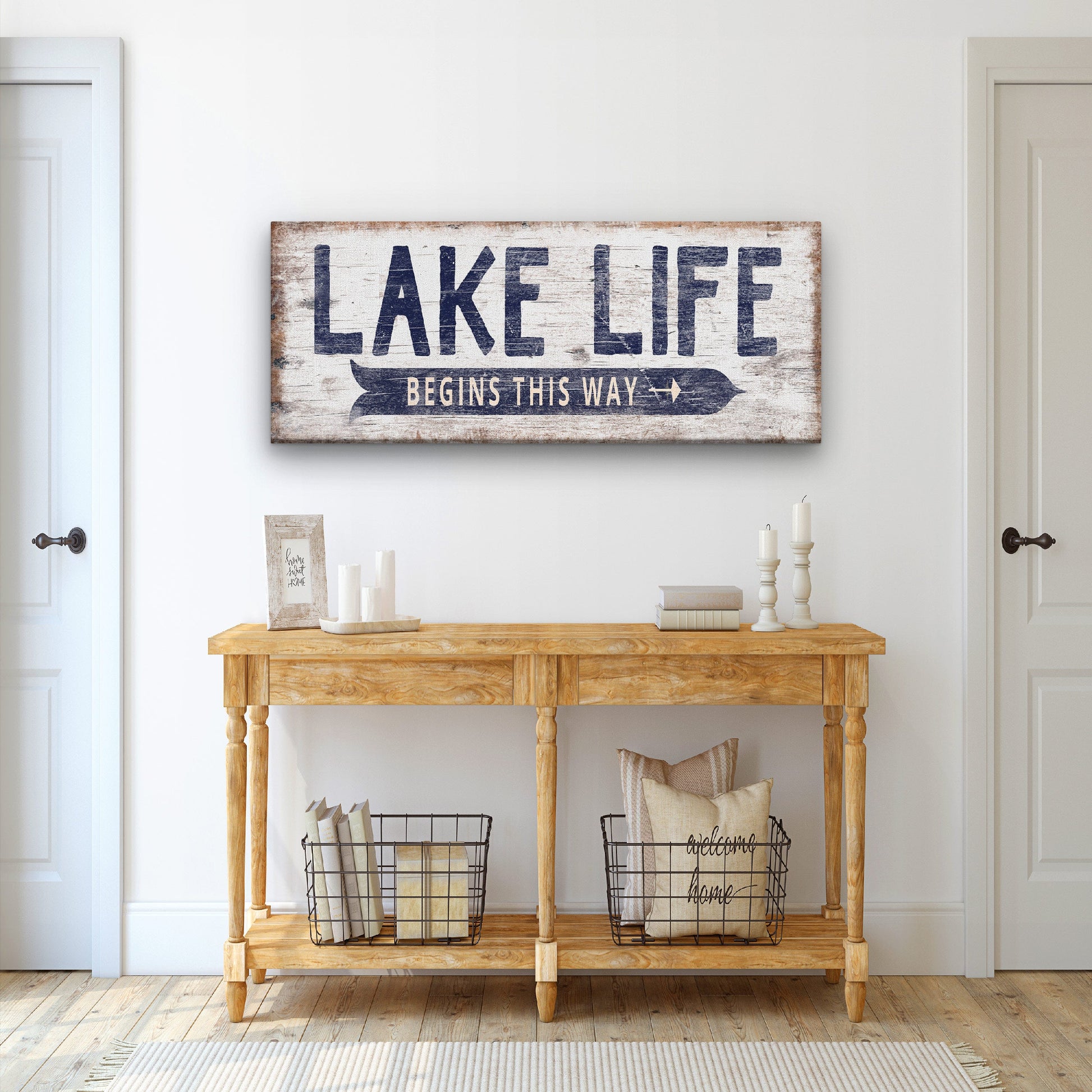 Lake directional canvas sign displayed in a home entryway